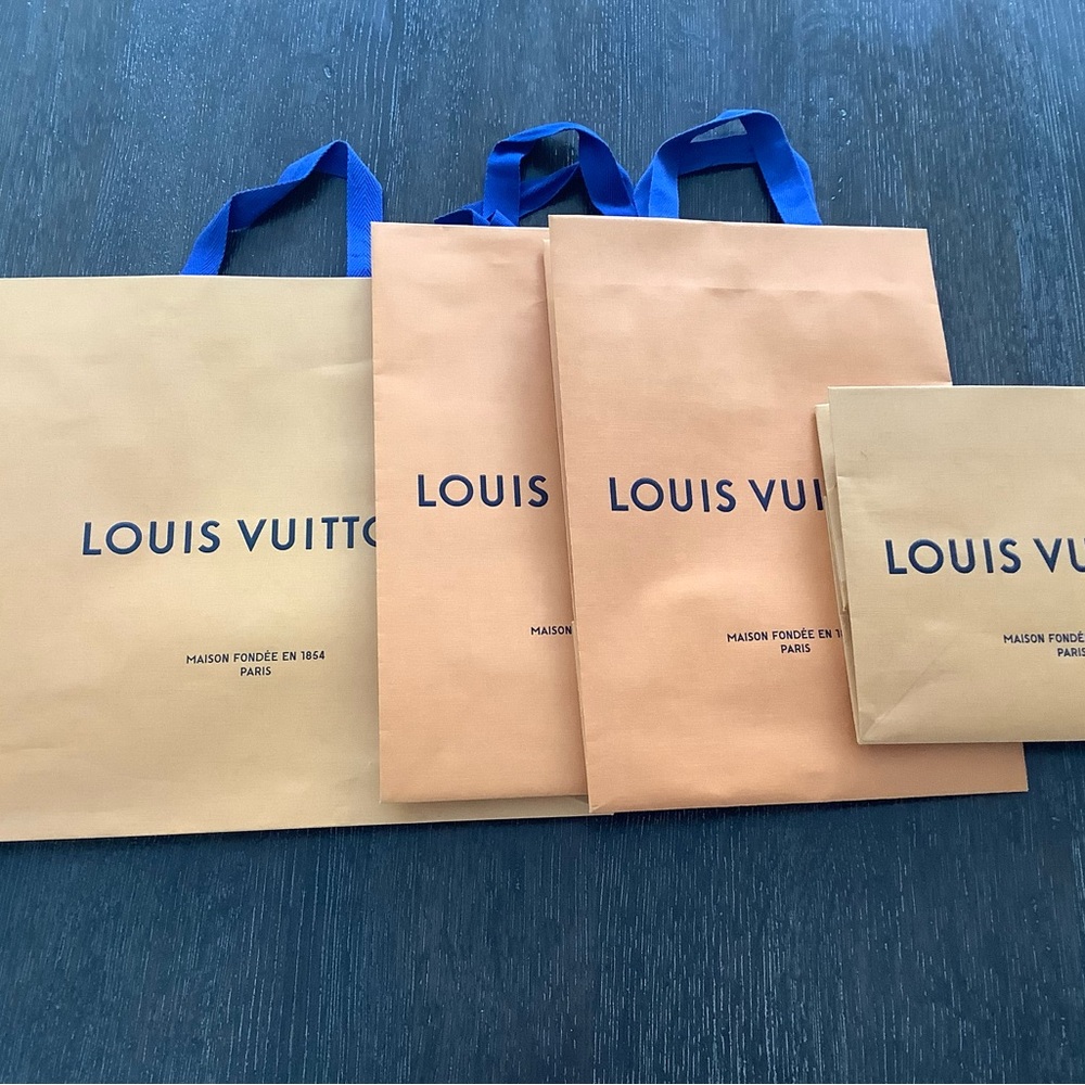Bundle of authentic Louis Vuitton shopping bags